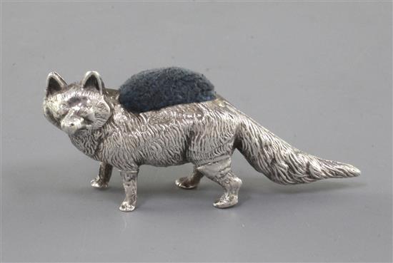 An Edwardian novelty silver pin cushion modelled as a fox by Levi & Salaman, 2.5in.